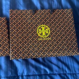 Two Tory Burch Shopping bags.